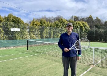 Deloraine Tennis Club Treasurer Mark Bailey standing on the tennis court