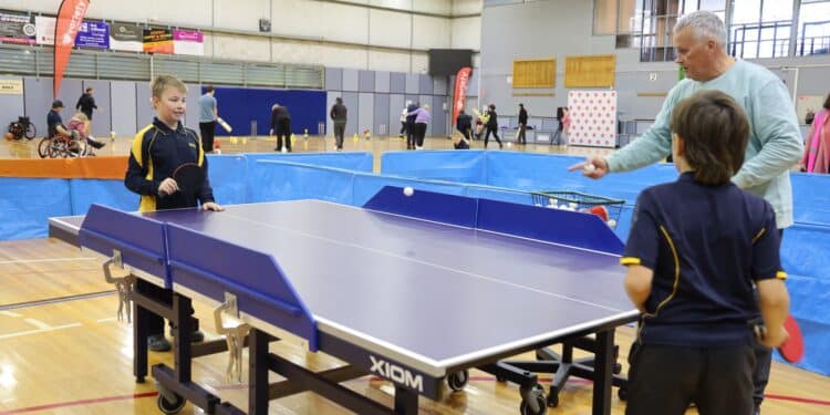 Variety kids playing table tennis on the sports day