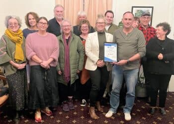 The Great Western Tiers Tourism Association collects the Top Small Town award on behalf of Deloraine.