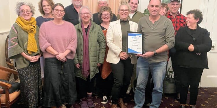 The Great Western Tiers Tourism Association collects the Top Small Town award on behalf of Deloraine.