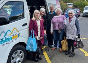 WESTBURY HEALTH women in front of the monthly bus