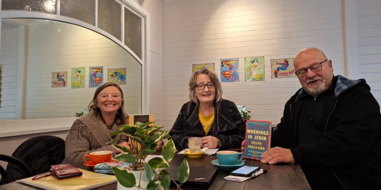 middle eastern book club's Three bookclub members, Catherine, Mark and Jane having an interesting conversation together.